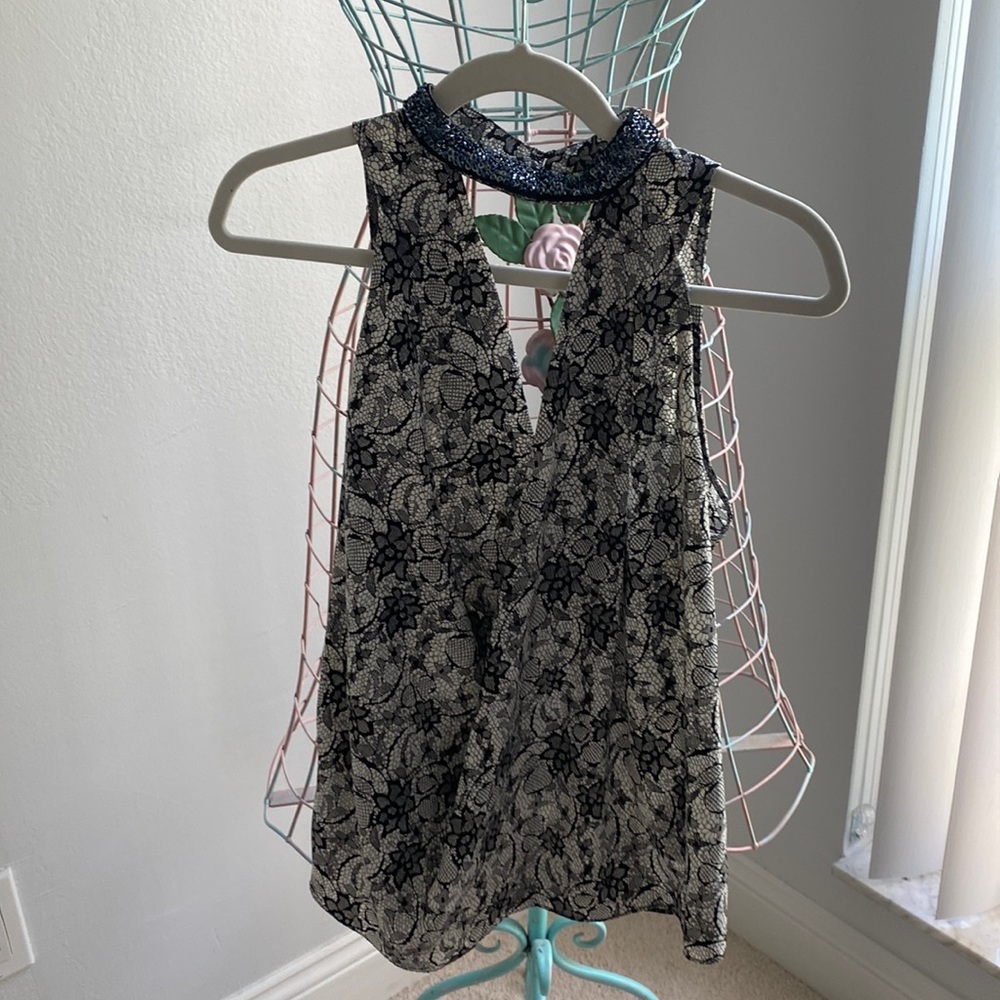 Very cute top beaded neckline open in back and low cut front